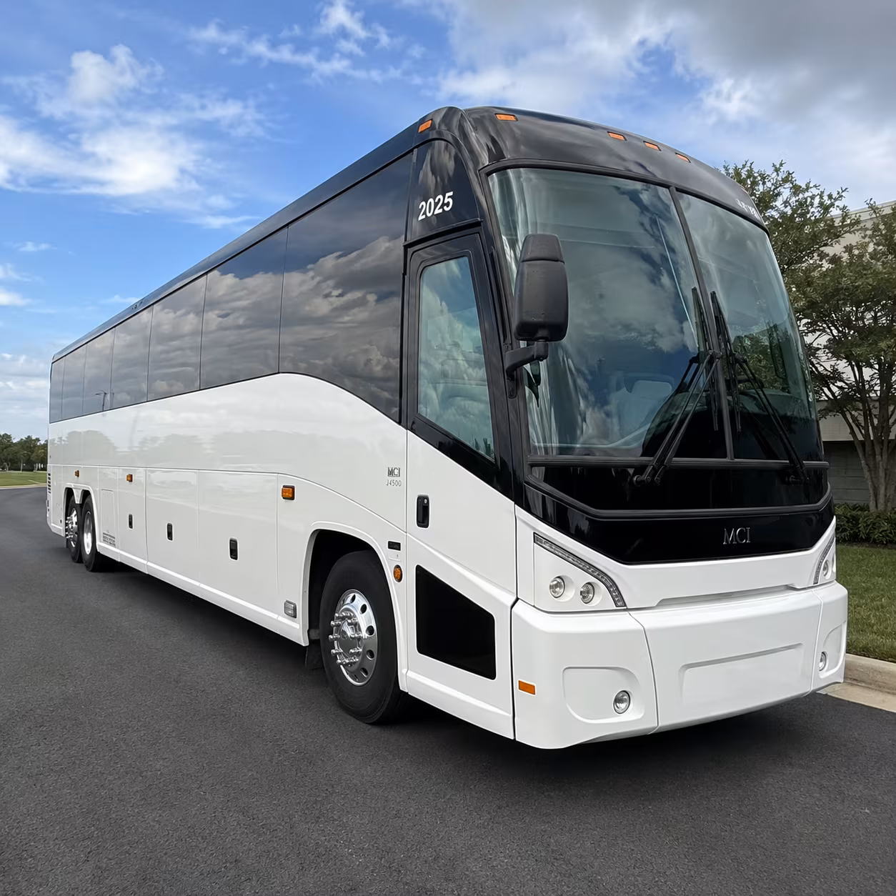 use a corporate bus rental to connect newton employees to logan airport